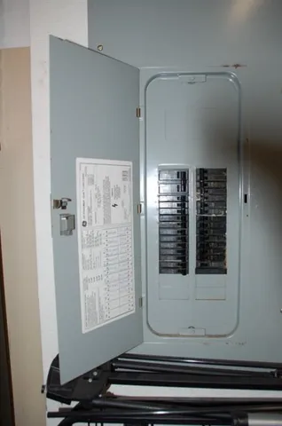 a room with gym equipment and large mirror