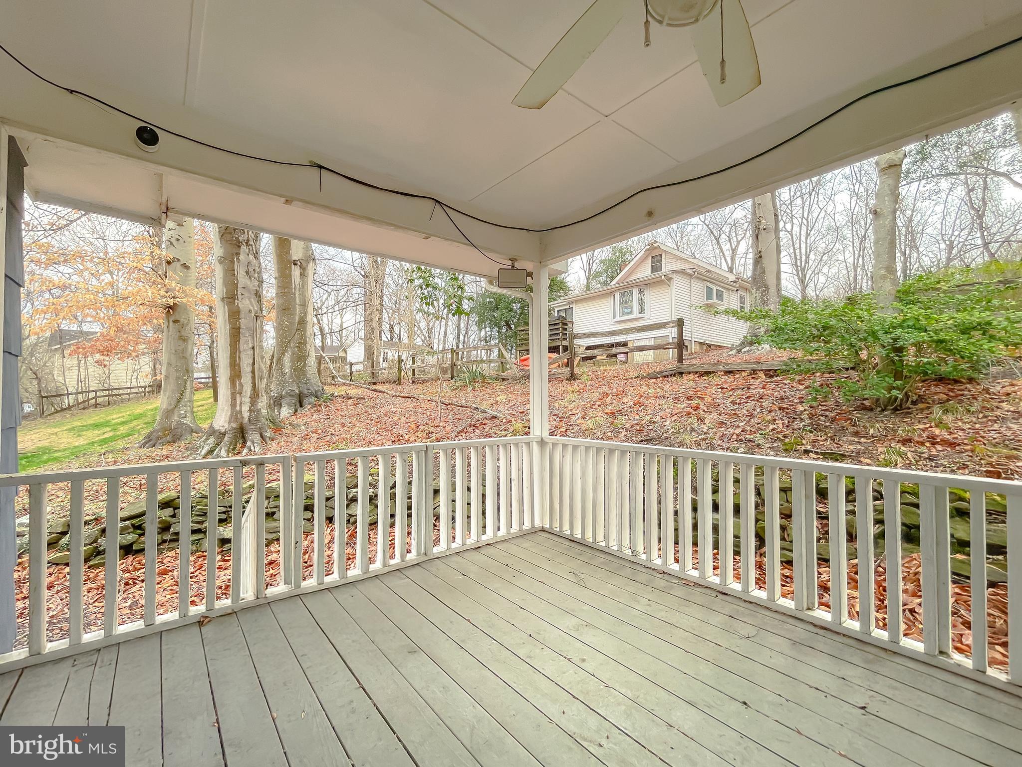 6056 Fir Road St. Leonard, MD 20685 - Photo 2 of 39 a view of a porch with wooden floor