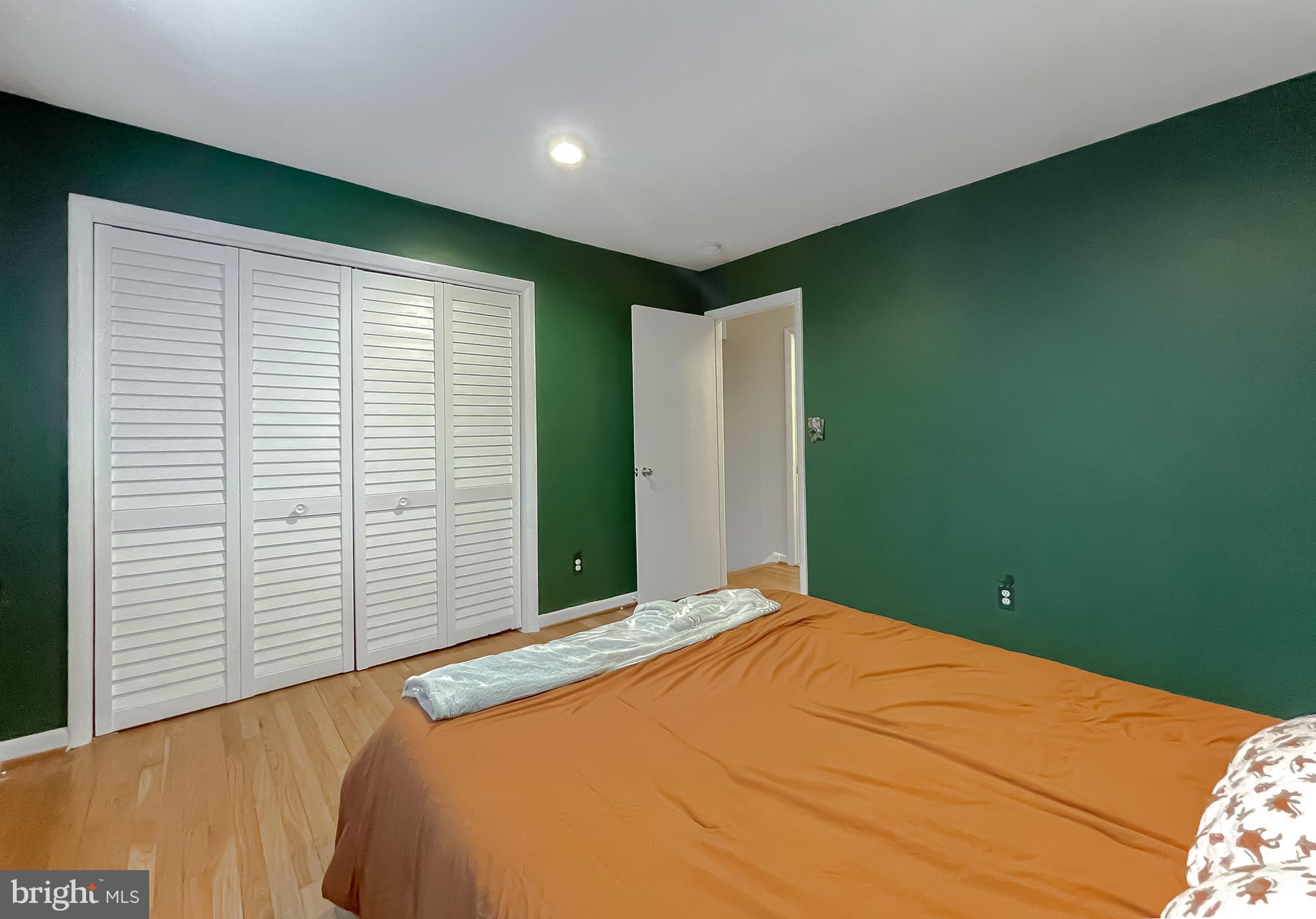 6056 Fir Road St. Leonard, MD 20685 - Photo 22 of 39 a bed room with a bed and a window