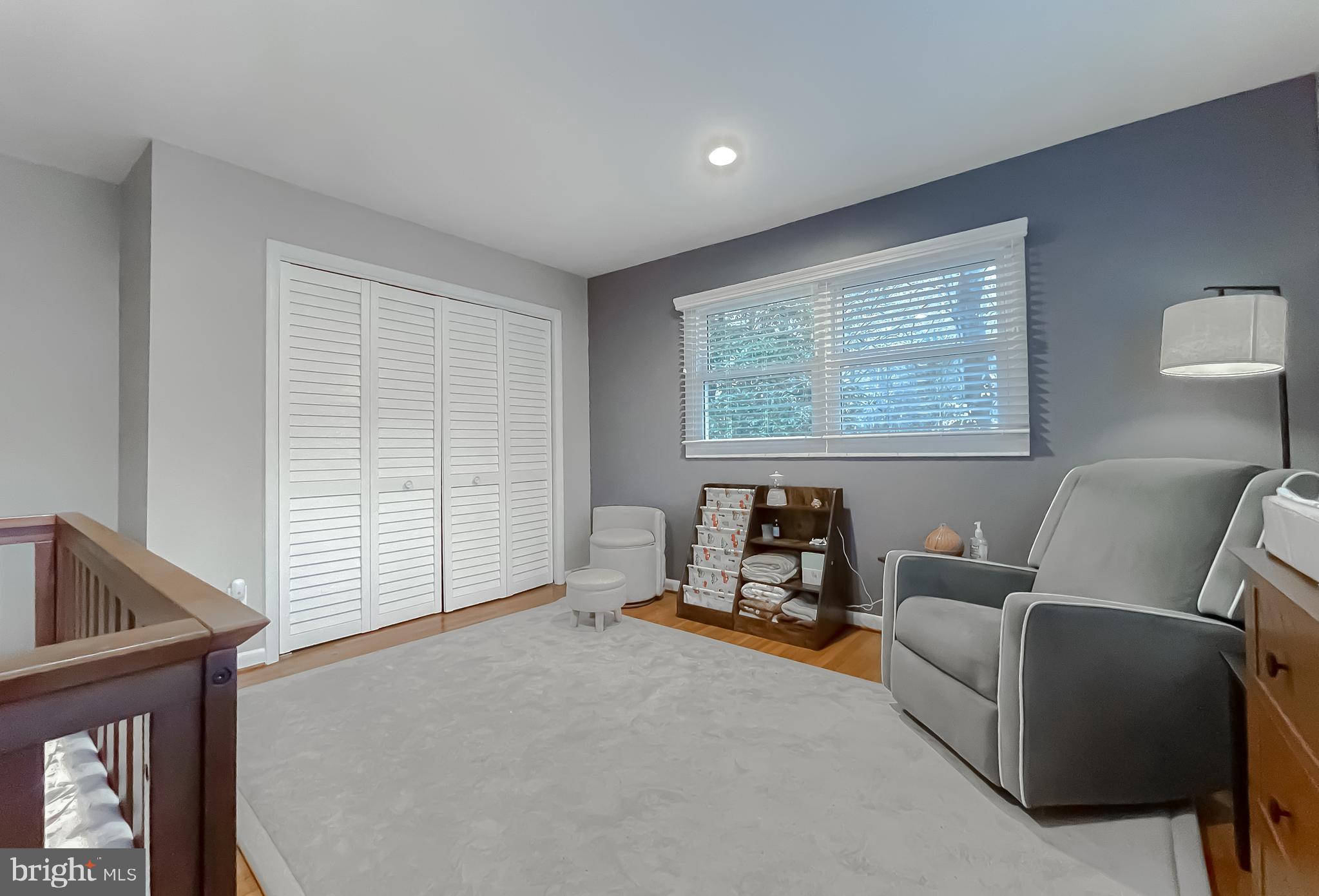 6056 Fir Road St. Leonard, MD 20685 - Photo 27 of 39 a living room with furniture and a window