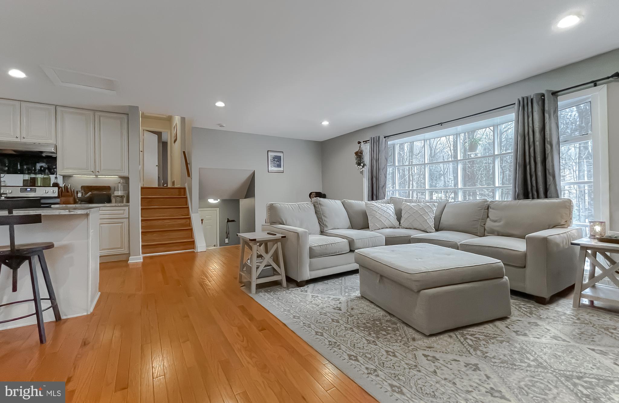 6056 Fir Road St. Leonard, MD 20685 - Photo 3 of 39 a living room with furniture and a large window