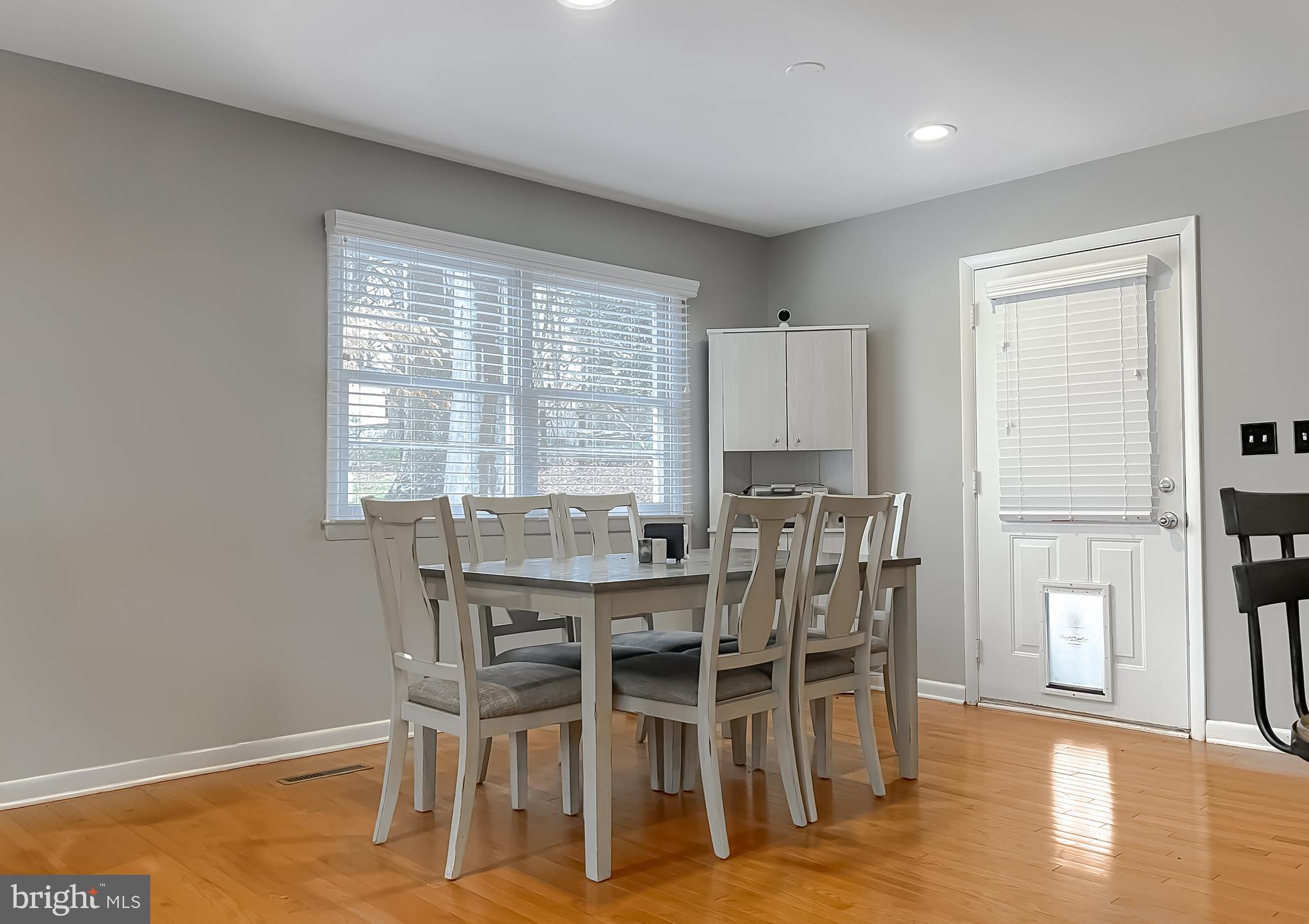 6056 Fir Road St. Leonard, MD 20685 - Photo 5 of 39 a view of a dining room with furniture and wooden floor