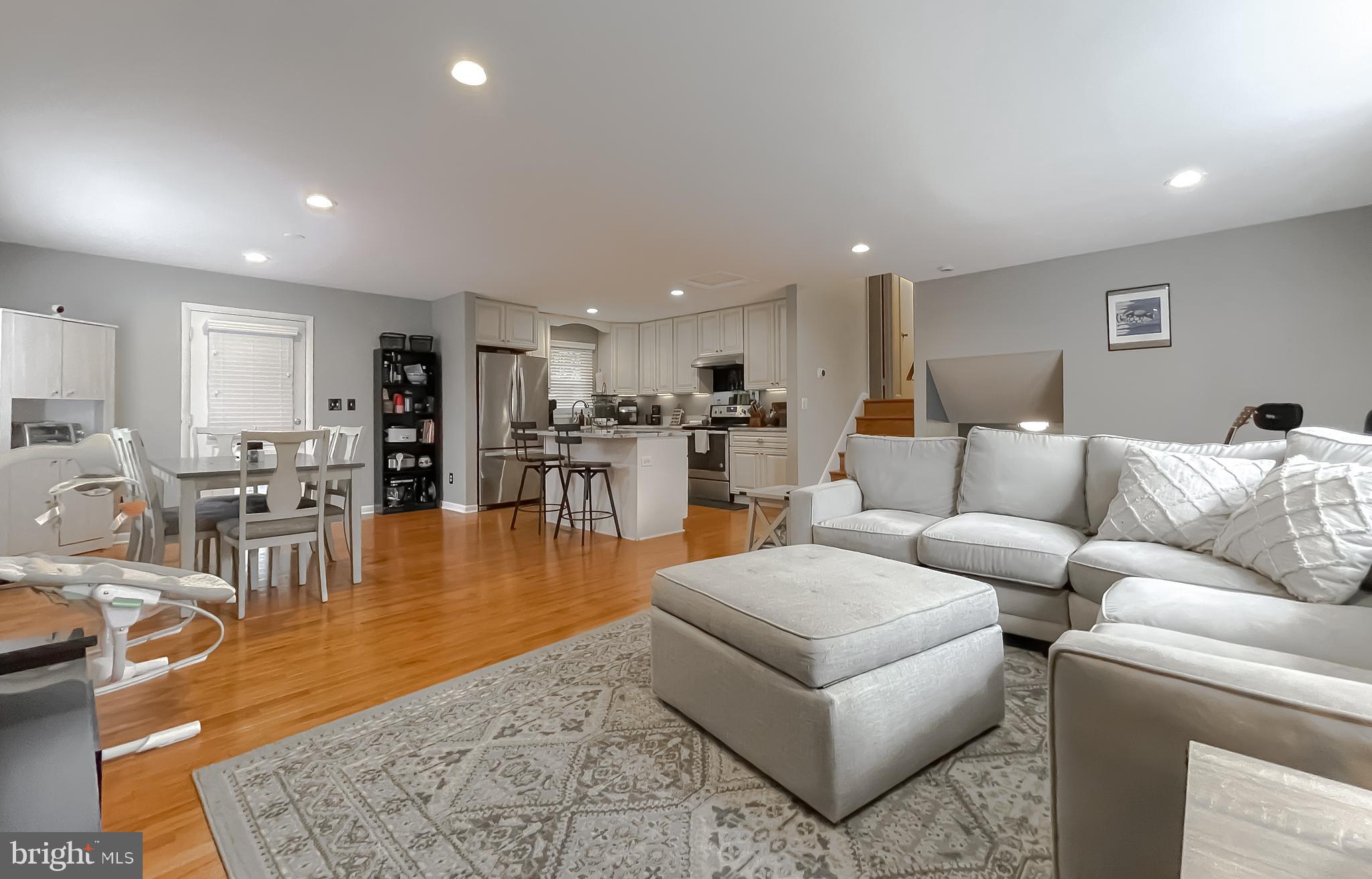 6056 Fir Road St. Leonard, MD 20685 - Photo 7 of 39 a living room with furniture and kitchen view