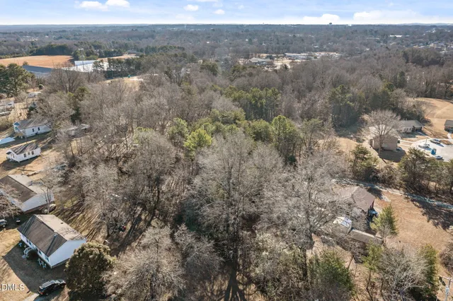 an aerial view of residential house and green space