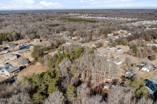 an aerial view of residential house and parking space