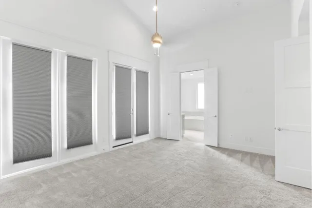 a view of an empty room with a fireplace