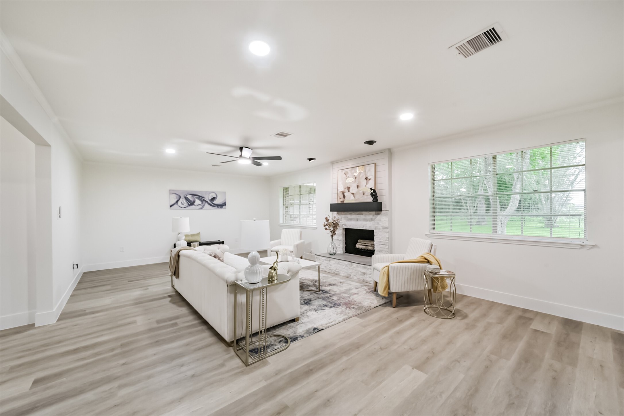 5403 Croix Road Manvel, TX 77578 - Photo 12 of 25 Cozy yet spacious living room featuring a fireplace, perfect for relaxing evenings and gathering with family and friends.