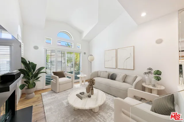 a view of a swimming pool with lounge chairs
