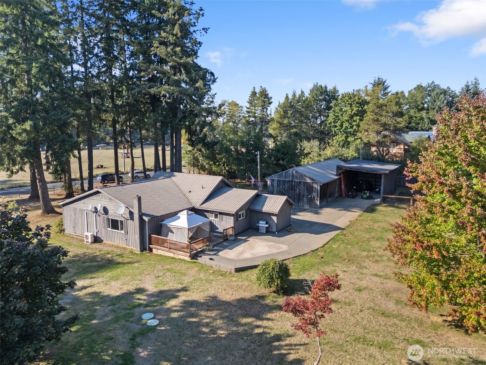 106 Pattee Road Chehalis, WA 98532 - Photo 29 of 40 a view of a house with swimming pool and sitting area