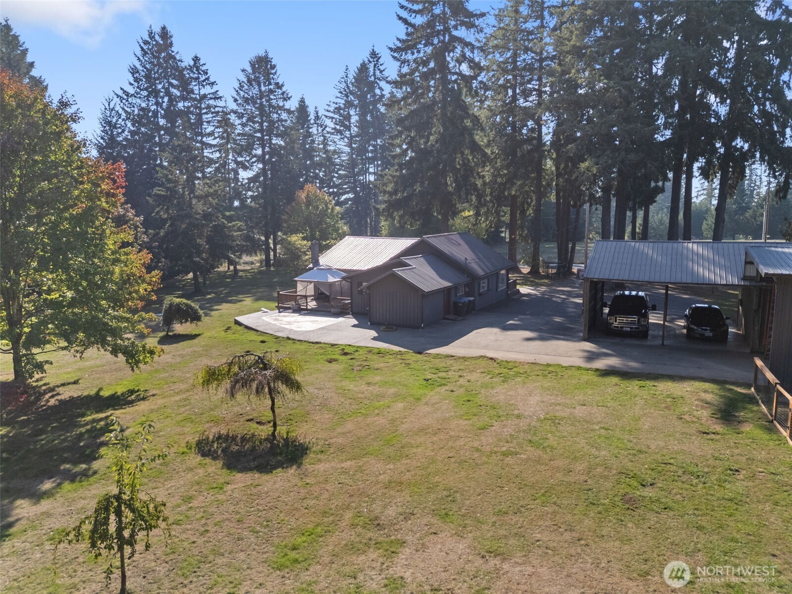 106 Pattee Road Chehalis, WA 98532 - Photo 32 of 40 a backyard of a house with yard and outdoor seating