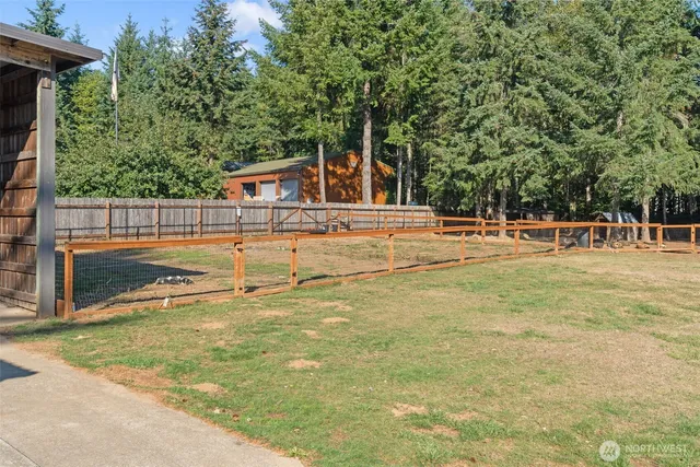 a view of a patio with a table and chairs