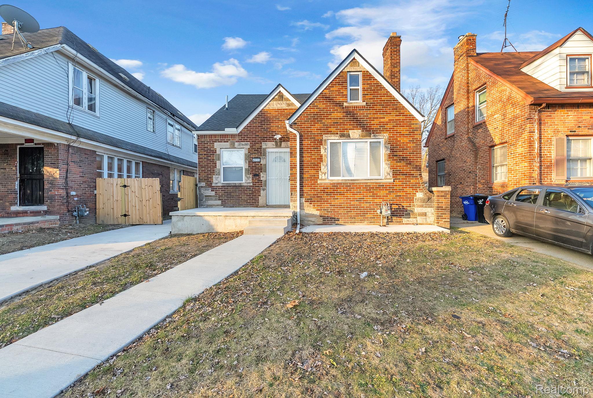 4113 Devonshire Road Detroit, MI 48224 - Photo 1 of 36 View of front of home featuring brick siding and a chimney