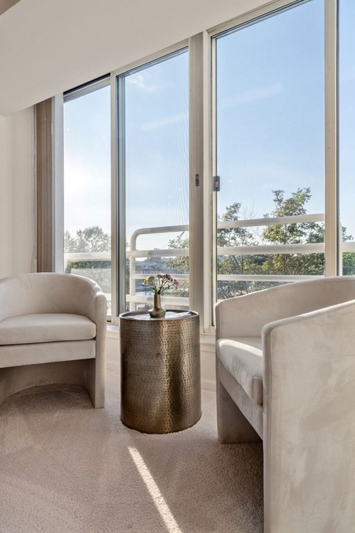 197 8th Street, Unit 330 Boston, MA 02129 - Photo 11 of 39 a living room with furniture and floor to ceiling window