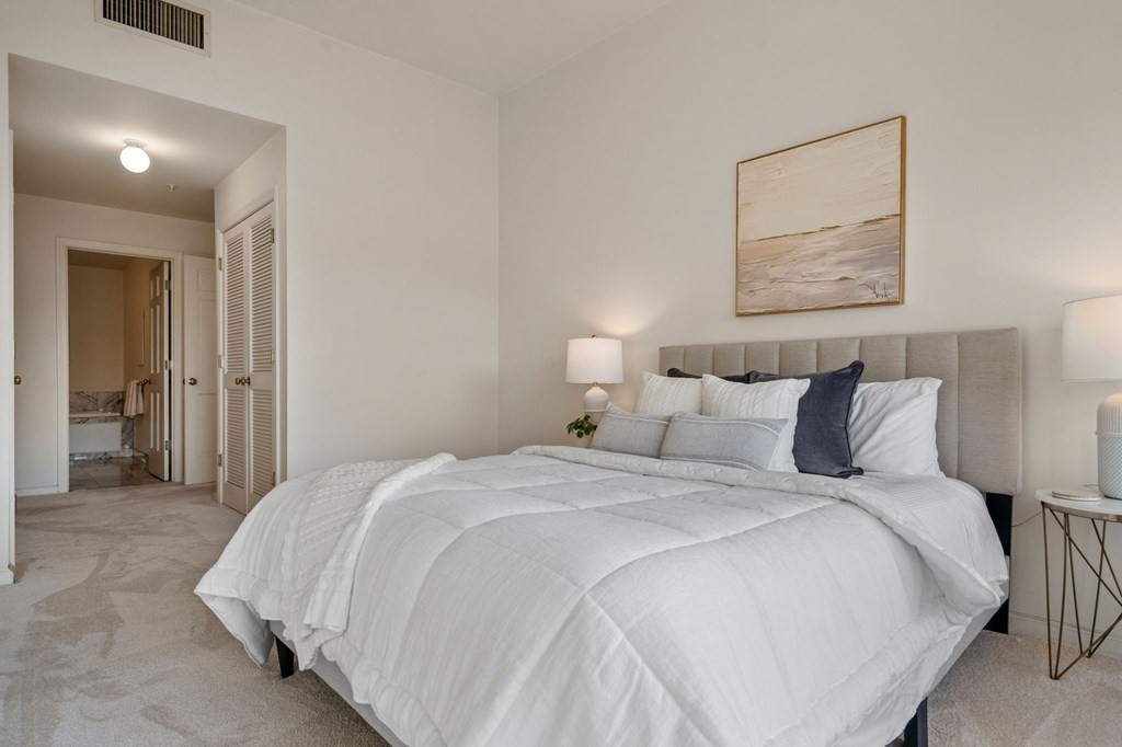 197 8th Street, Unit 330 Boston, MA 02129 - Photo 12 of 39 a bedroom with a bed and a painting on the wall