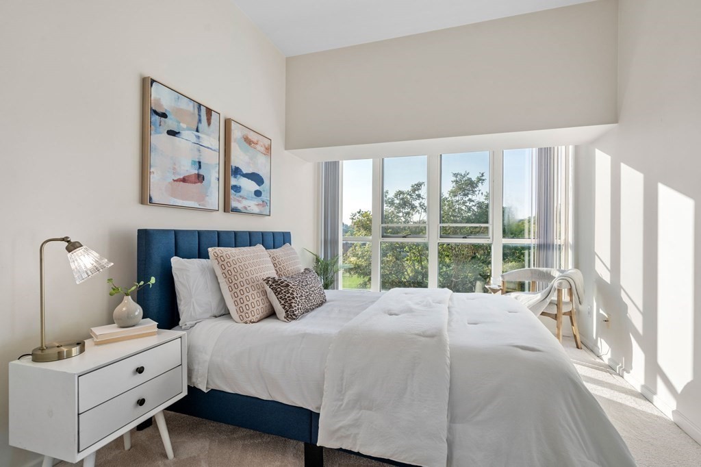 197 8th Street, Unit 330 Boston, MA 02129 - Photo 13 of 39 a bed room with a bed and a large window