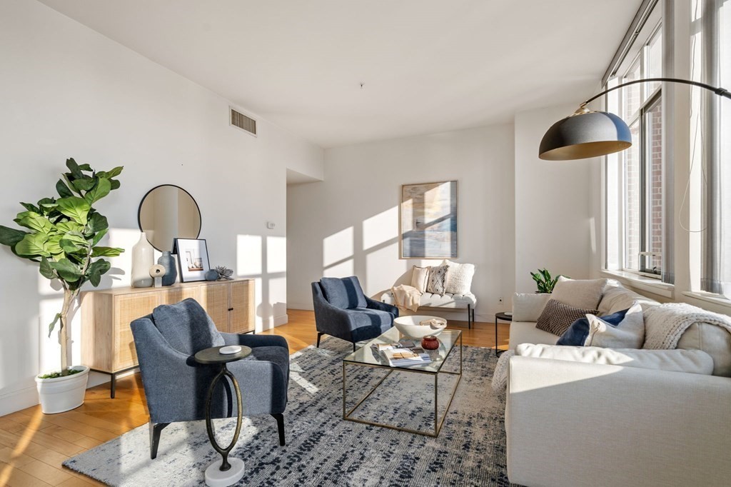 197 8th Street, Unit 330 Boston, MA 02129 - Photo 2 of 39 a living room with furniture and a potted plant