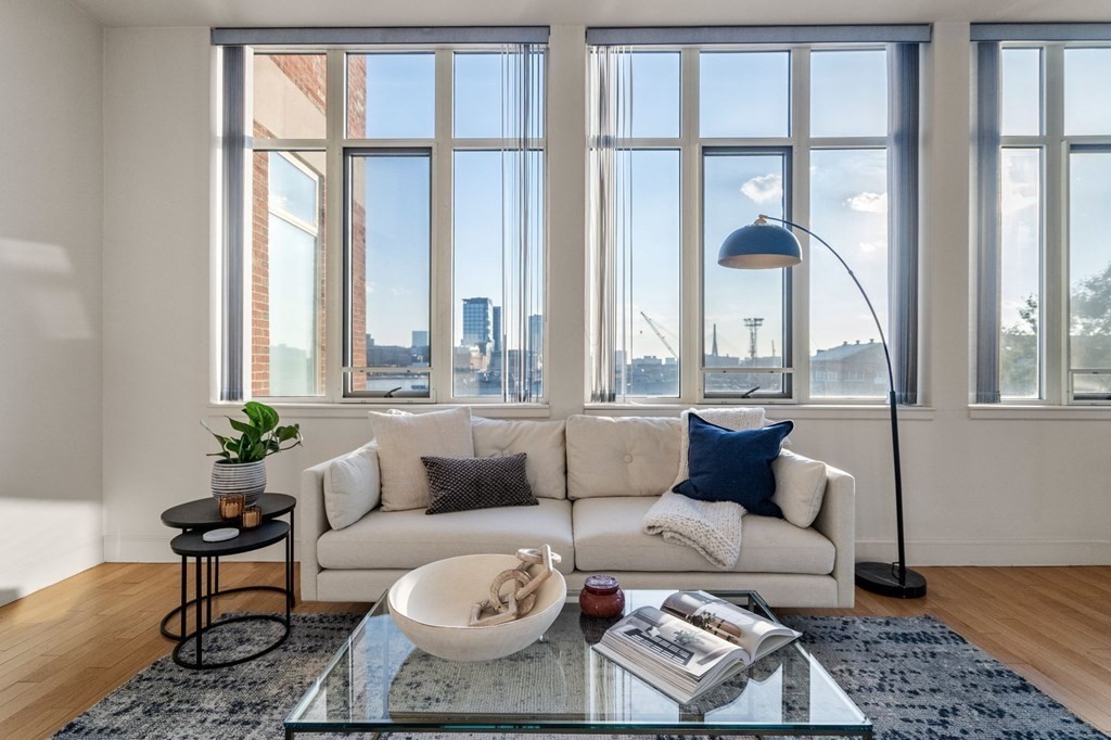 197 8th Street, Unit 330 Boston, MA 02129 - Photo 21 of 39 a living room with furniture and a large window