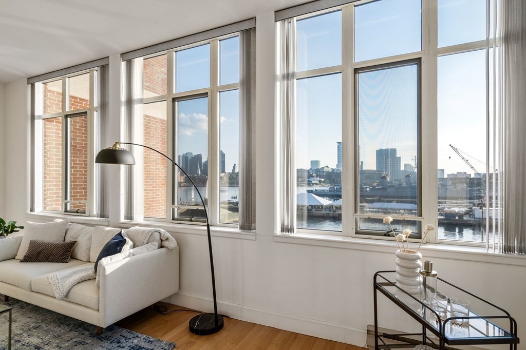 197 8th Street, Unit 330 Boston, MA 02129 - Photo 24 of 39 a living room with furniture and a window