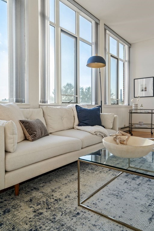 197 8th Street, Unit 330 Boston, MA 02129 - Photo 26 of 39 a living room with furniture and a large window