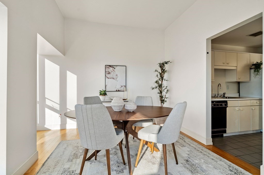 197 8th Street, Unit 330 Boston, MA 02129 - Photo 6 of 39 a view of a dining room with furniture window and wooden floor