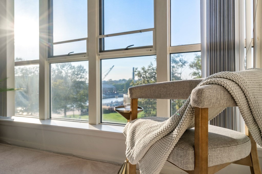 197 8th Street, Unit 330 Boston, MA 02129 - Photo 10 of 39 a living room with furniture and a window