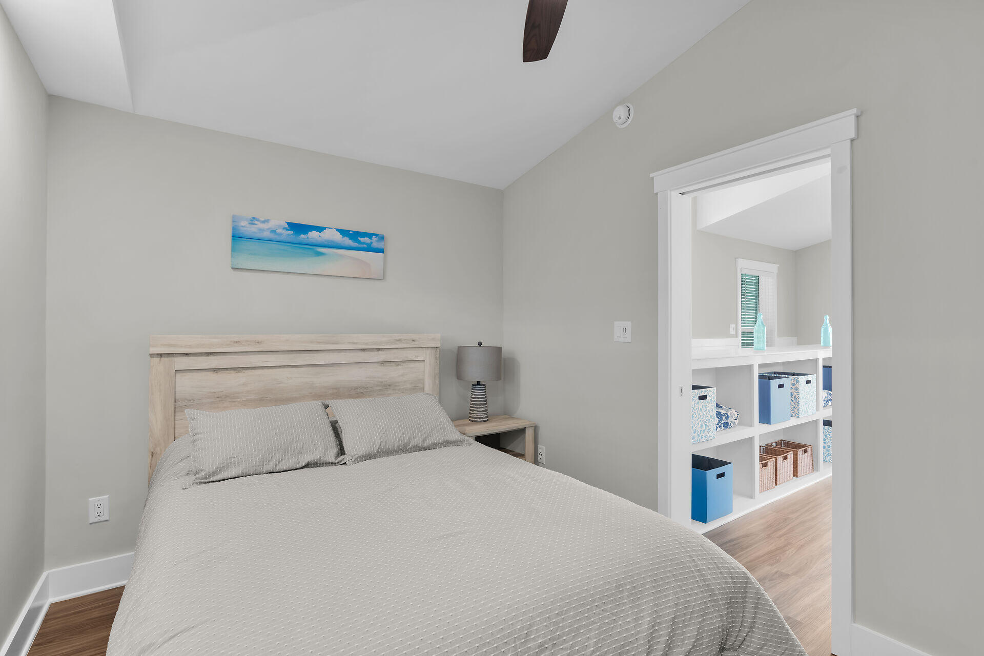 101 11th Street, Unit 19 Marathon, FL 33050 - Photo 16 of 27 a bedroom with a bed and a painting on the wall