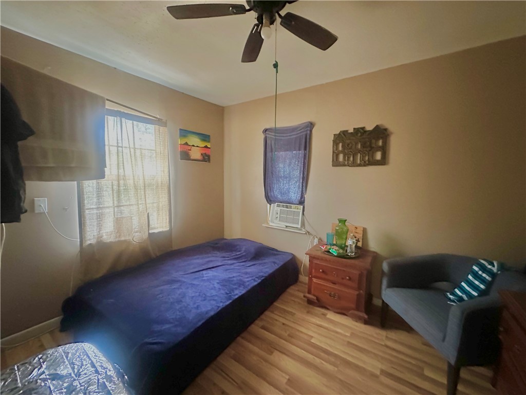 801 Ruben Chavez Road Robstown, TX 78380 - Photo 9 of 18 a bedroom with a bed dresser and a window