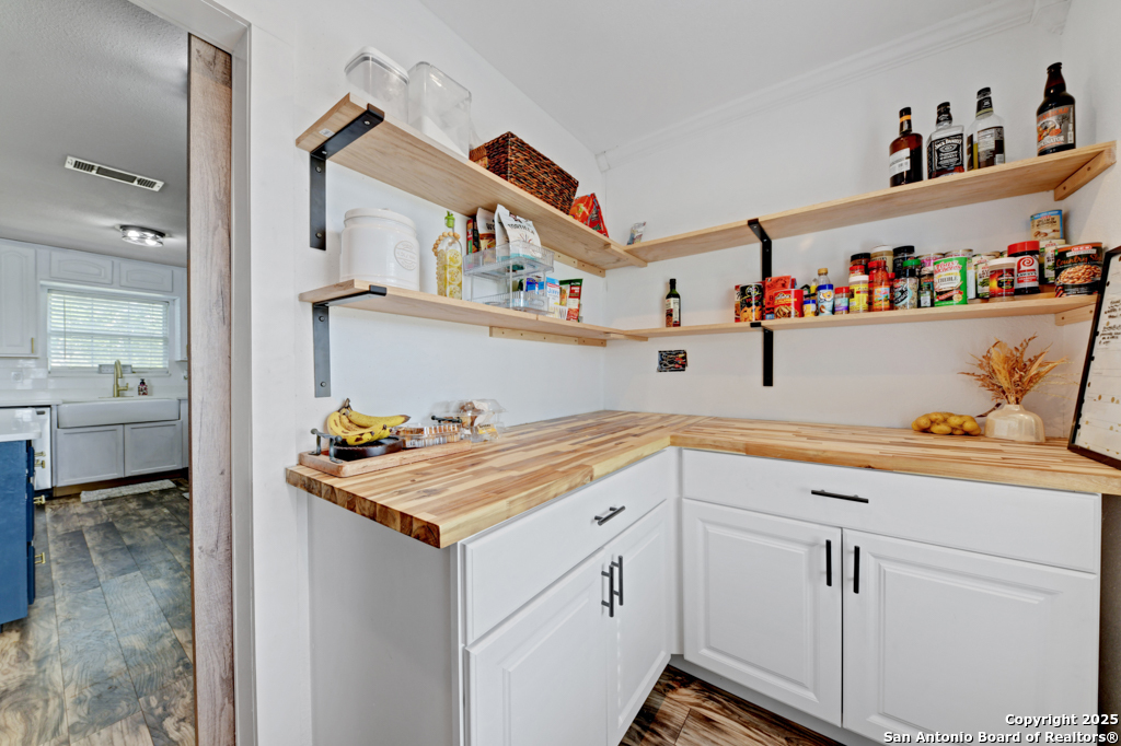 1510 Timmermann Road Seguin, TX 78155 - Photo 11 of 32 a utility room with cabinets