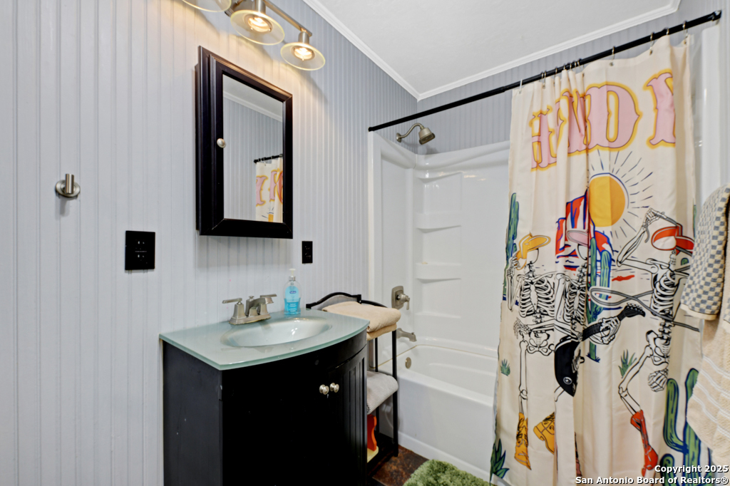 1510 Timmermann Road Seguin, TX 78155 - Photo 21 of 32 a bathroom with a sink and a mirror