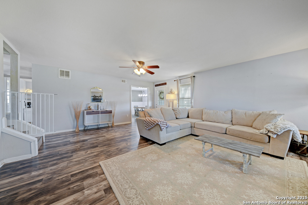 1510 Timmermann Road Seguin, TX 78155 - Photo 4 of 32 a living room with furniture and a wooden floor