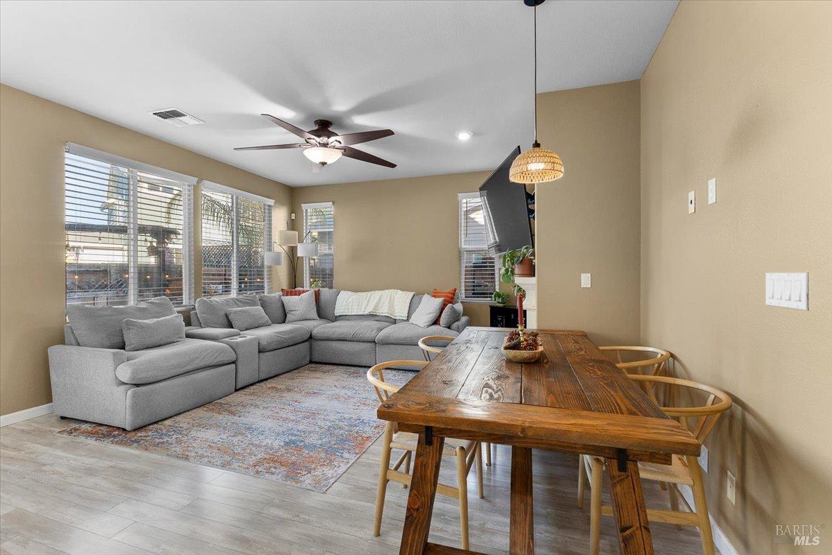 2067 San Miguel Avenue Santa Rosa, CA 95403 - Photo 12 of 38 a living room with furniture a window and a chandelier