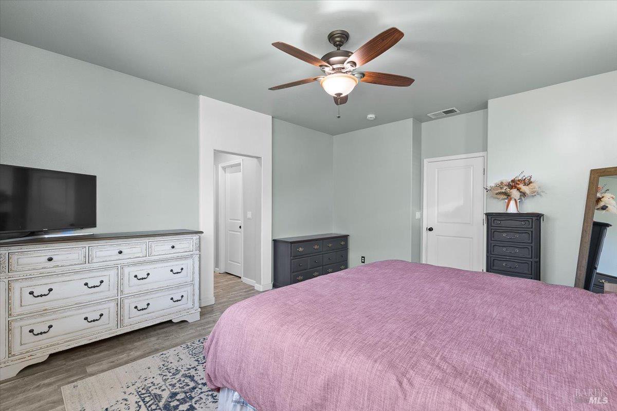 2067 San Miguel Avenue Santa Rosa, CA 95403 - Photo 16 of 38 a bedroom with a bed and a dresser in it