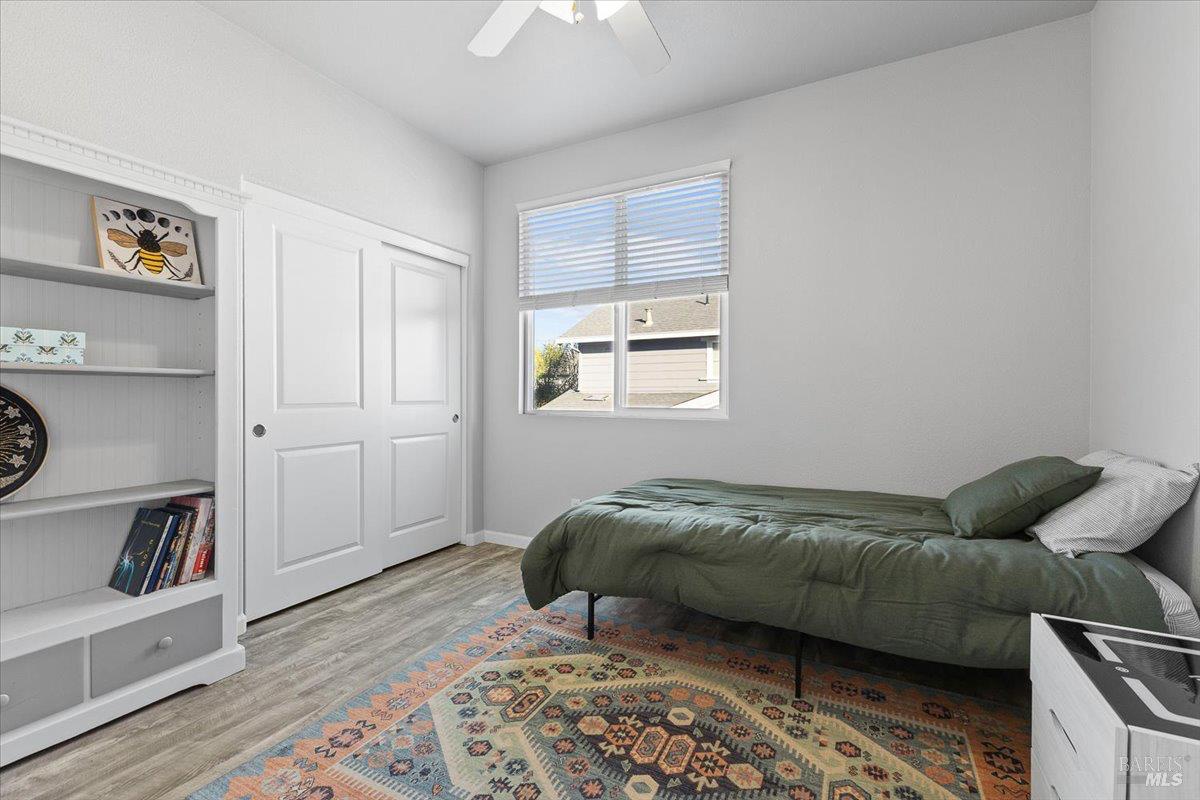 2067 San Miguel Avenue Santa Rosa, CA 95403 - Photo 19 of 38 a living room with a bed furniture and a window