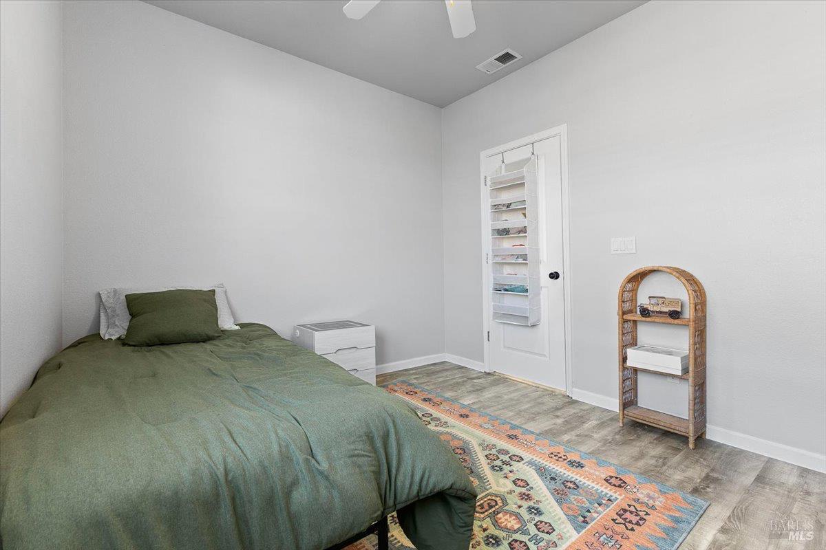 2067 San Miguel Avenue Santa Rosa, CA 95403 - Photo 20 of 38 a bedroom with a bed and a table