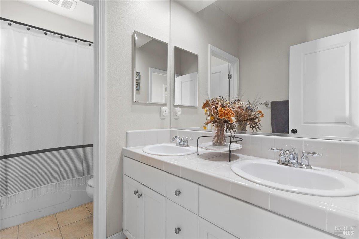 2067 San Miguel Avenue Santa Rosa, CA 95403 - Photo 21 of 38 a bathroom with a sink and a mirror