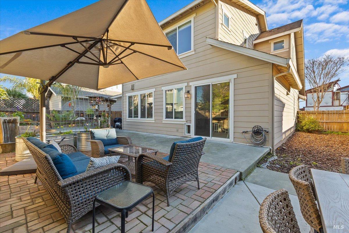 2067 San Miguel Avenue Santa Rosa, CA 95403 - Photo 26 of 38 a view of a patio with a table and chairs under an umbrella
