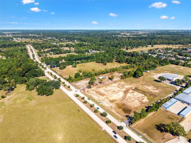 an aerial view of residential building and lake