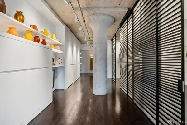 a bedroom with a bed window and a potted plant