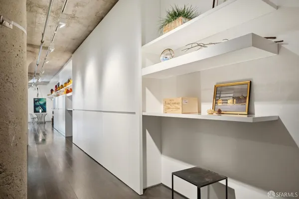 a view of a hallway view with wooden floor and staircase