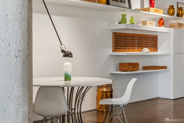 a lobby with furniture and a flat screen tv