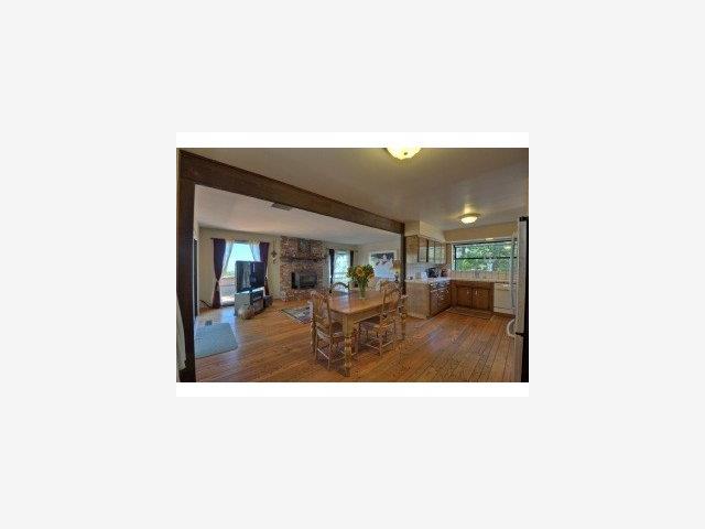 19580 Montevina Road Los Gatos, CA 95033 - Photo 6 of 9 a view of living room with kitchen island furniture and a chandelier