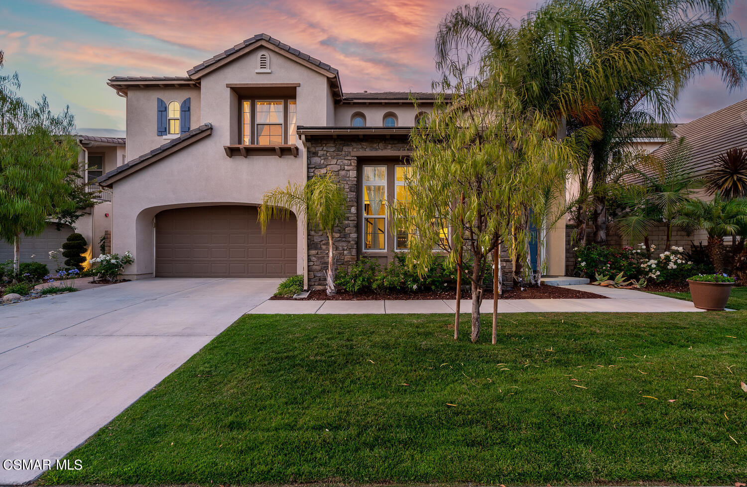 13967 Bear Fence Court Moorpark, CA 93021 - Photo 1 of 50 a front view of a house with a garden and trees