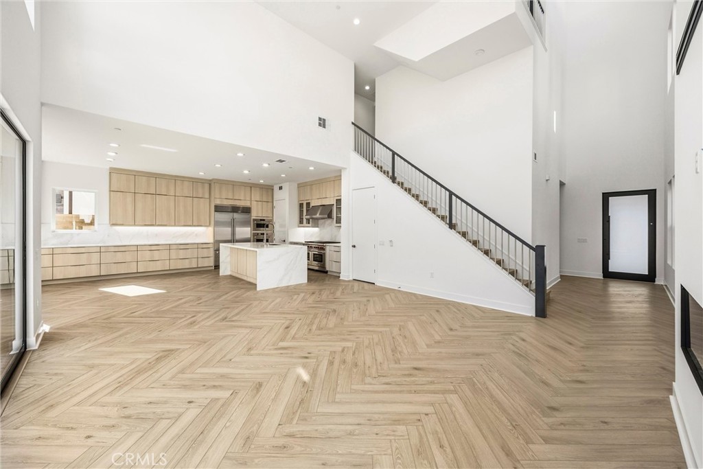 164 Apron Irvine, CA 92618 - Photo 11 of 67 a view of a hallway with wooden floor and staircase