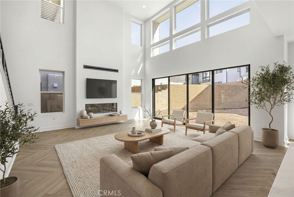 164 Apron Irvine, CA 92618 - Photo 12 of 67 a living room with furniture and a flat screen tv