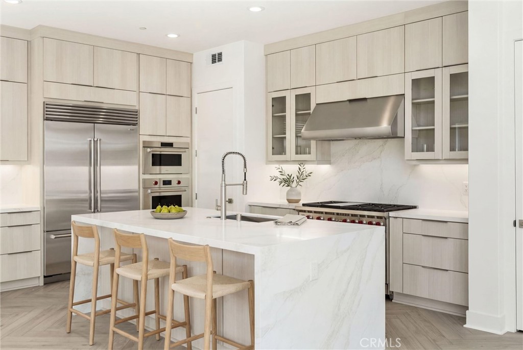 164 Apron Irvine, CA 92618 - Photo 15 of 67 a kitchen with stainless steel appliances granite countertop a sink stove and refrigerator