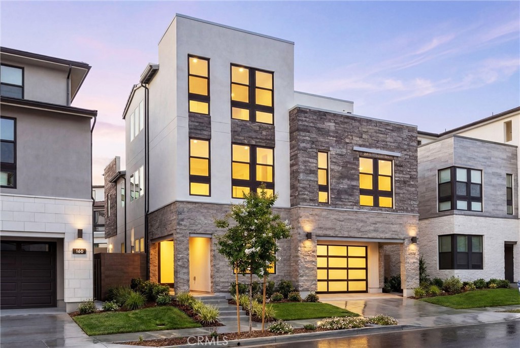 164 Apron Irvine, CA 92618 - Photo 3 of 67 a front view of a multi story residential apartment building