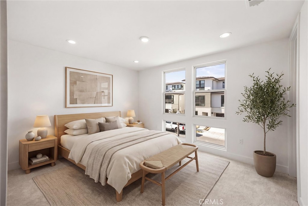 164 Apron Irvine, CA 92618 - Photo 35 of 67 a bedroom with a large bed and a potted plant