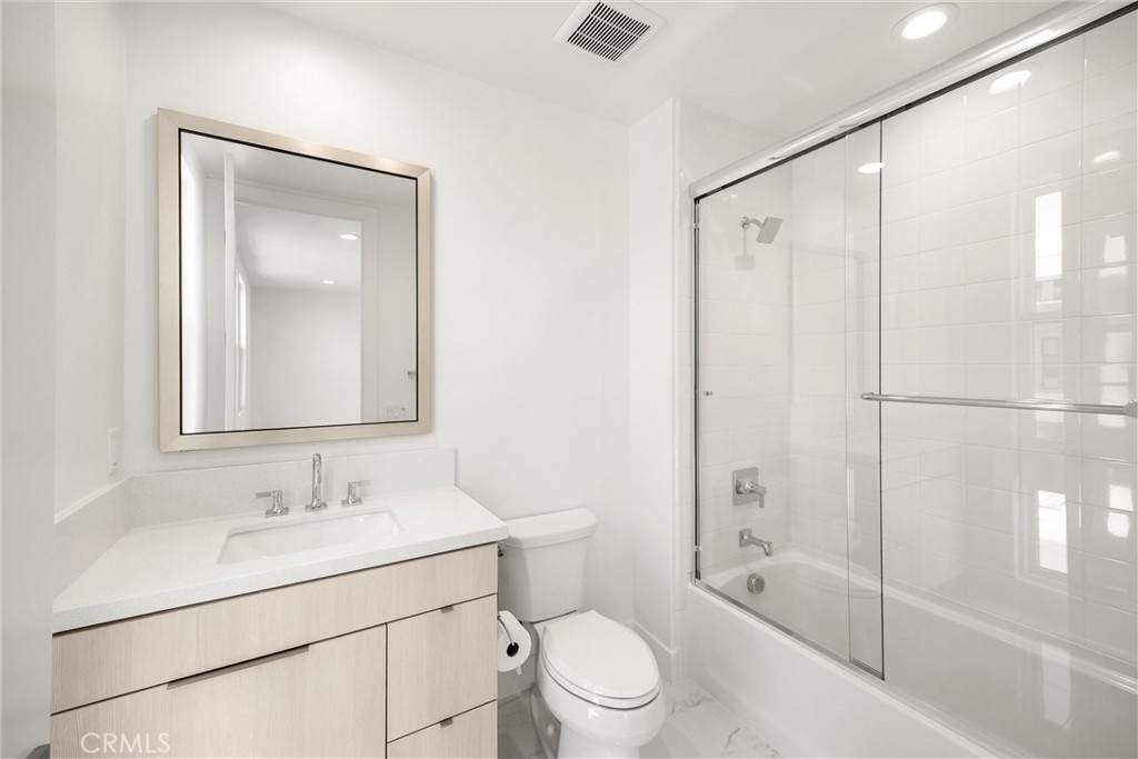 164 Apron Irvine, CA 92618 - Photo 36 of 67 a bathroom with a sink a toilet and shower