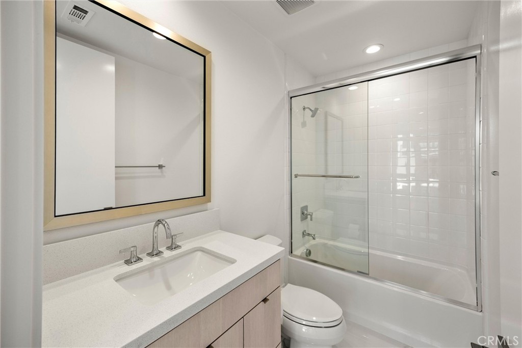 164 Apron Irvine, CA 92618 - Photo 40 of 67 a bathroom with a granite countertop sink toilet and shower