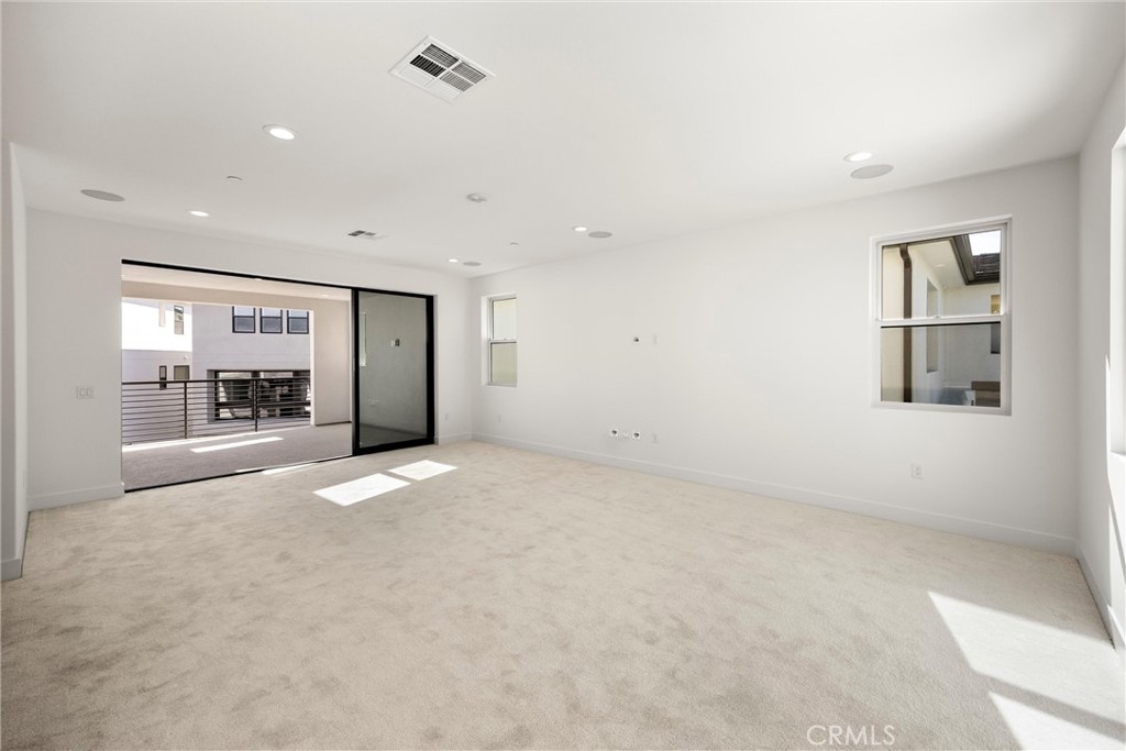 164 Apron Irvine, CA 92618 - Photo 41 of 67 a view of a big room with closet and windows